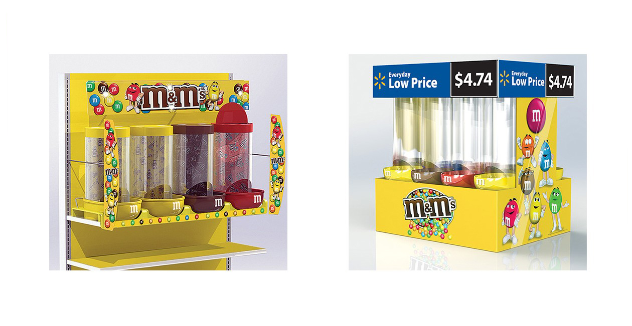 Two M&M's candy display stands in bright yellow, featuring colorful dispensers and cartoon characters with branding and pricing.
